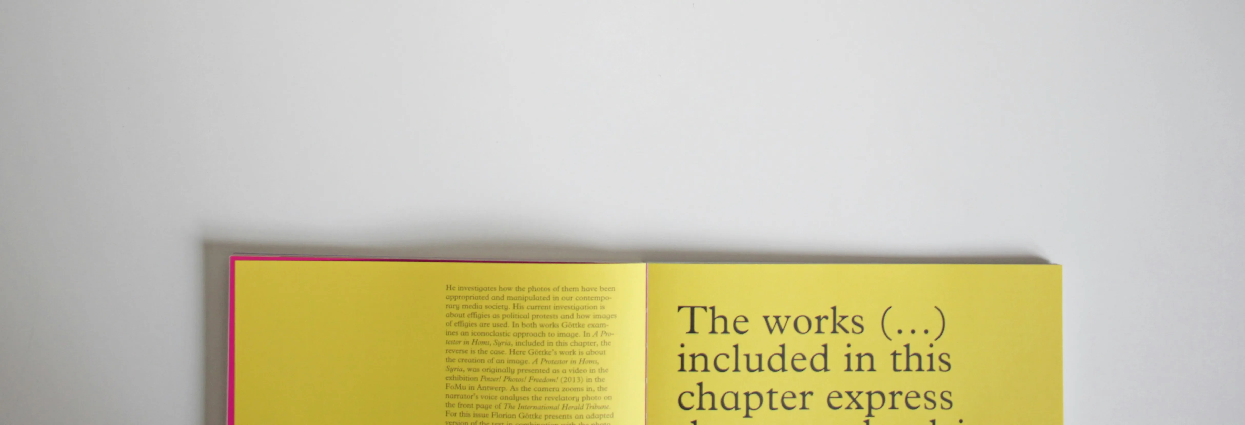 Open yellow book with large serif text on a light background, representing abstract guidelines